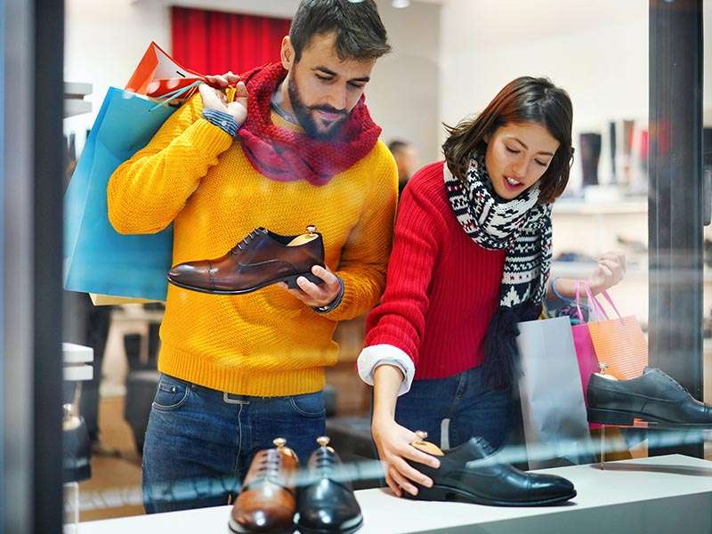 Man and woman shopping for shoes