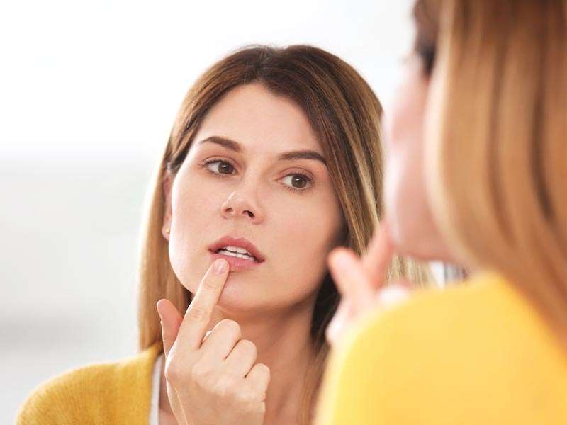 Woman touching her lip
